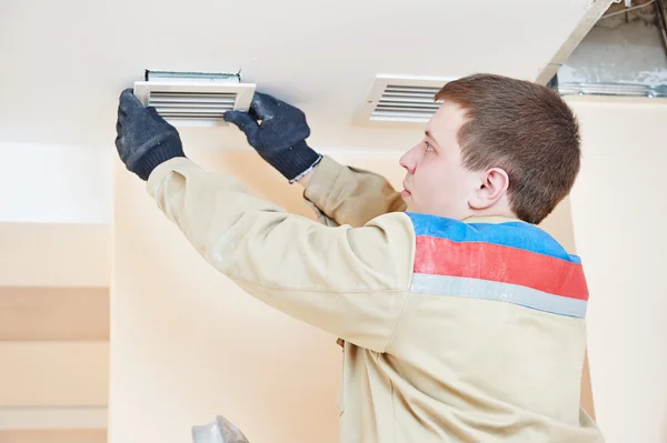 Technician Performing Duct Cleaning
